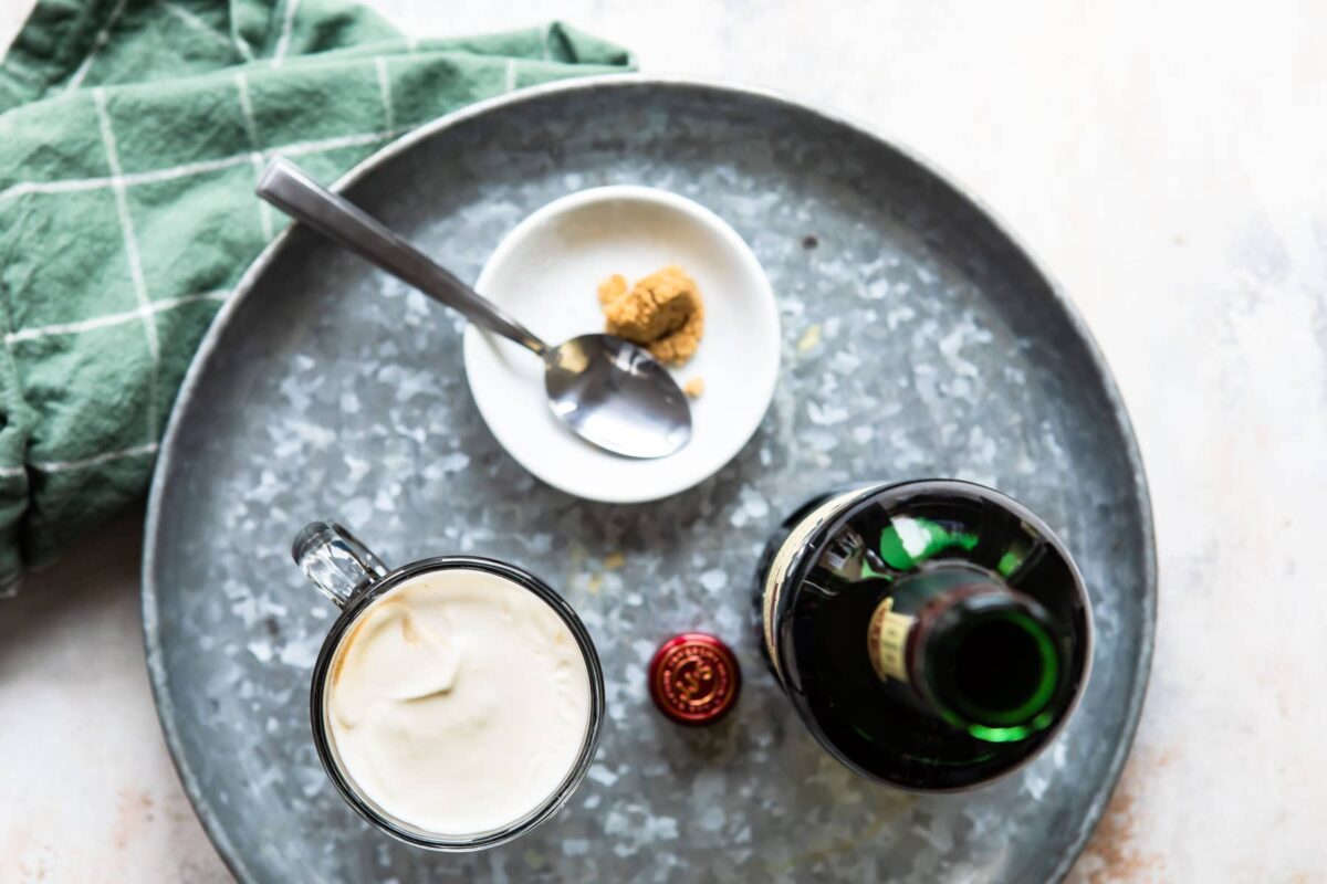 A tray with Irish Coffee and a bottle of Jameson Irish whiskey.