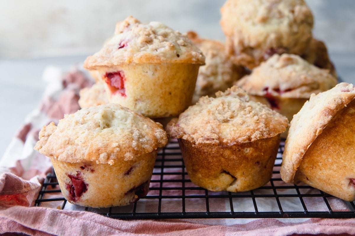 Strawberry Rhubarb Muffins on a cooling rack.