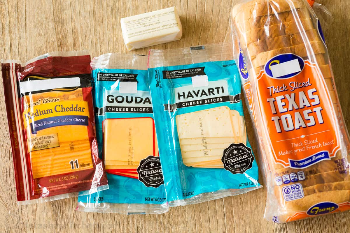 Ingredients for making grilled cheese with bread, sliced cheese and butter