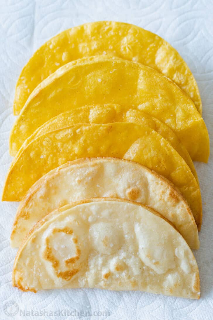 Homemade Hard Taco Shells arranged on a paper towel 